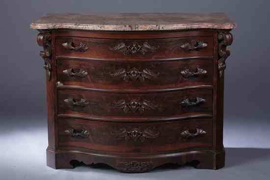 Appraisal: AMERICAN VICTORIAN CARVED ROSEWOOD SERPENTINE-FRONT CHEST-OF-DRAWERS th century Molded-edge marble