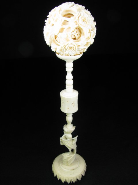 Appraisal: Carved ivory puzzle or mystery ball with carved stand Stand