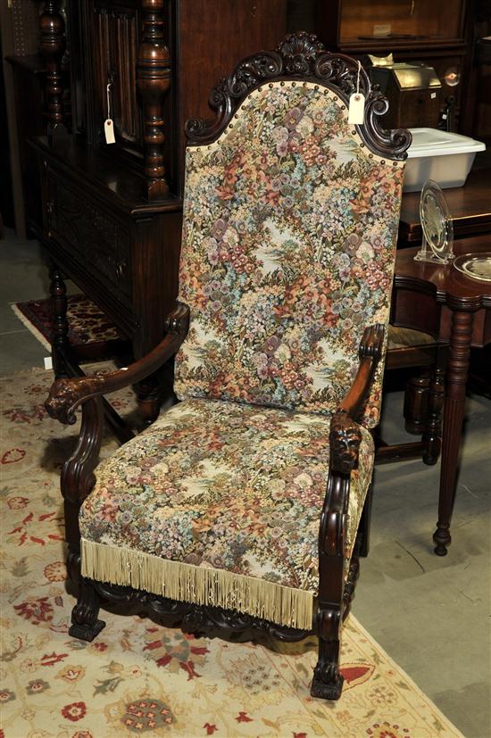 Appraisal: HIGHBACK ARMCHAIR Oak chair having a shell carved crest lion's