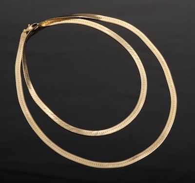 Appraisal: A Ladies' Long Herringbone Chain Necklace k yellow gold herringbone