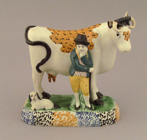 Appraisal: Prattware figure of a farmer and cow early th c