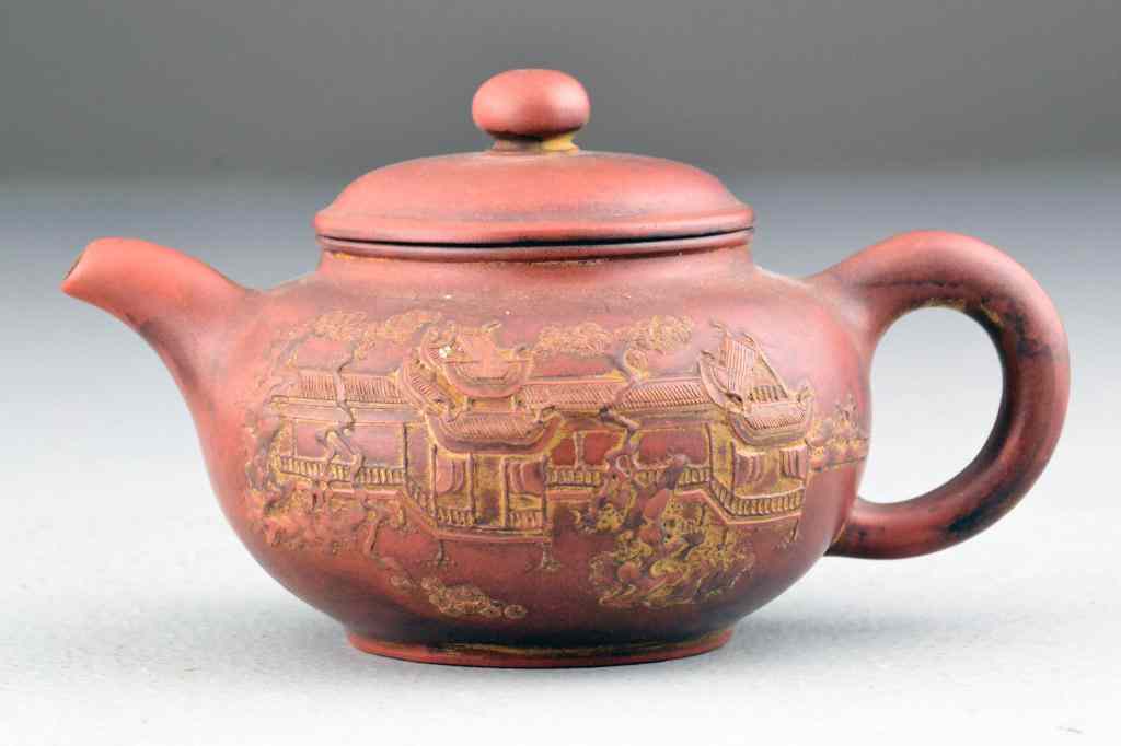 Appraisal: Chinese Yixing Pottery Tea PotFinely molded with raised pagoda within