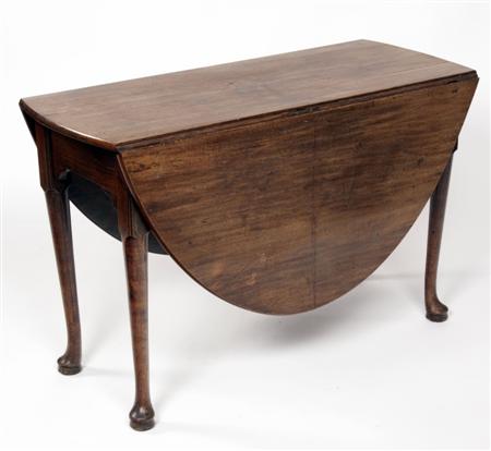 Appraisal: A George III mahogany gateleg table the oval top raised