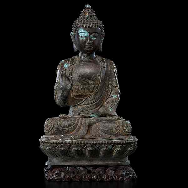 Appraisal: Chinese Bronze Buddha Chinese th century A seated Buddha on