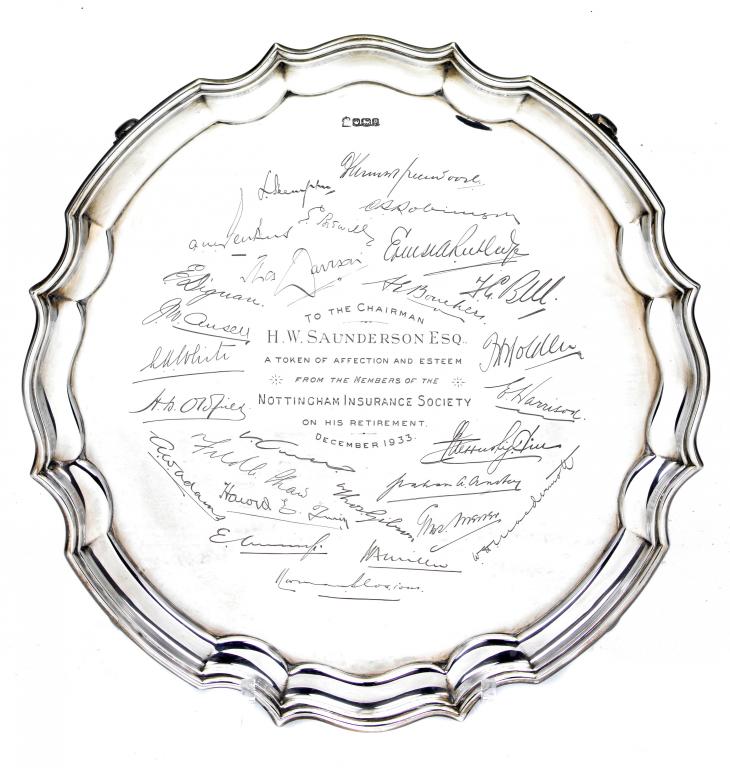 Appraisal: A GEORGE V SALVER the field engraved with a presentation