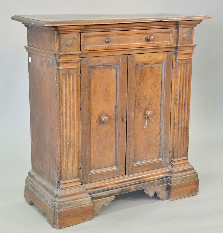 Appraisal: Continental walnut cabinet having rectangular top over one drawer over