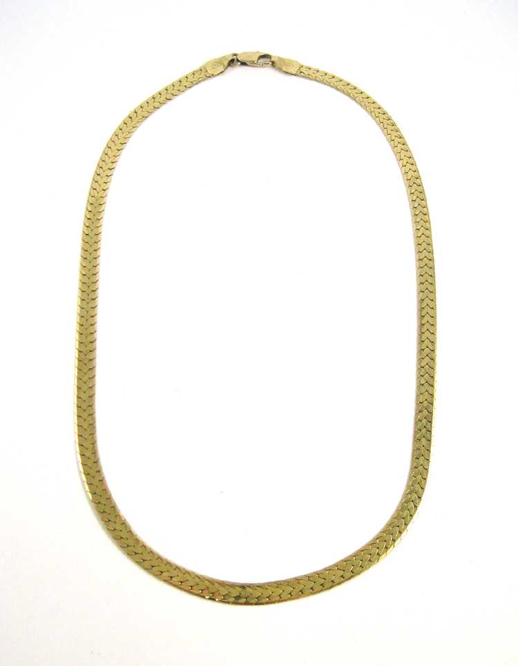 Appraisal: FOURTEEN KARAT GOLD CHAIN NECKLACE wide herringbone variation pattern with