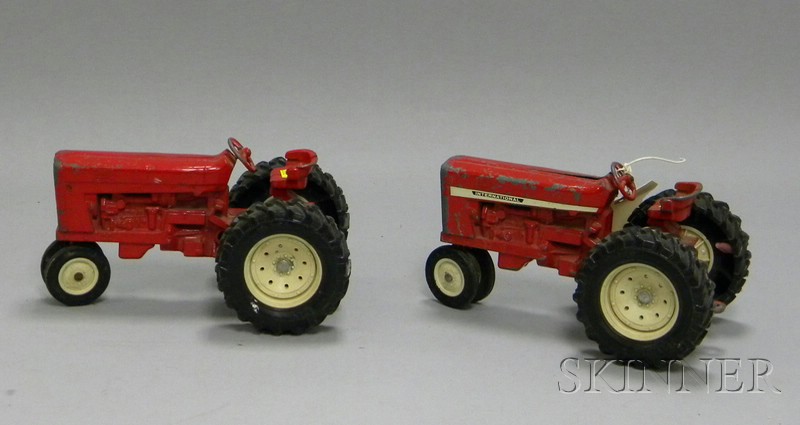 Appraisal: Two Toy Red Metal Tractors one International Harvester one stamped