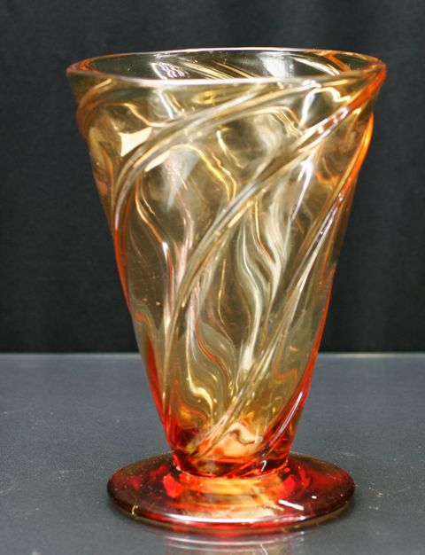 Appraisal: A Webb amber cone shaped vase with spiral decoration cm