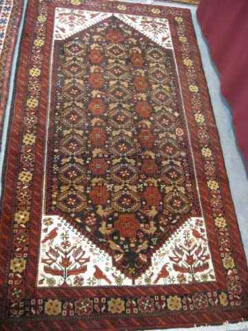 Appraisal: Belouchi Persian Handmade Rug intricate geometrics florals birds throughout red