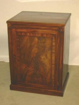 Appraisal: A MAHOGANY PIER CABINET of oblong form with reeded edged