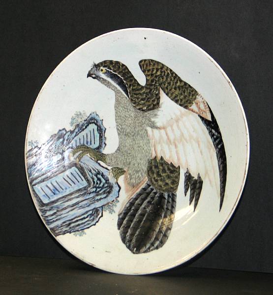 Appraisal: A studio ceramic charger with falcon design th Century The