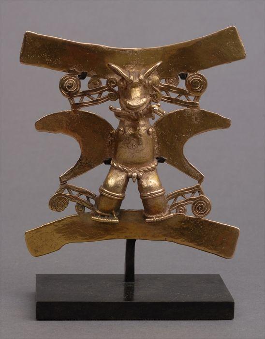 Appraisal: PRE-COLUMBIAN-STYLE GOLD FIGURAL PENDANT The composite male deity with animal