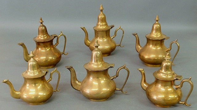 Appraisal: Assembled set of six Middle Eastern brass water pots Tallest