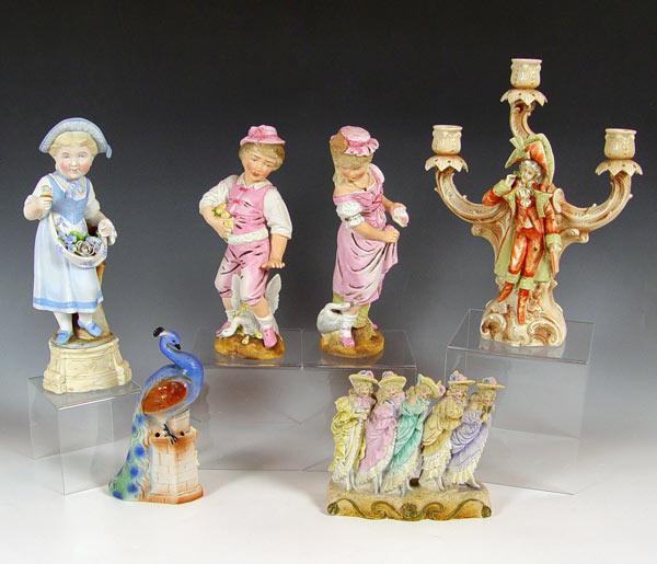 Appraisal: VICTORIAN BISQUE FIGURES Includes figural group pair light candle holder