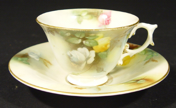 Appraisal: Royal Worcester cup and saucer hand painted with roses printed