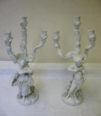 Appraisal: A PAIR OF DRESDEN PORCELAIN BLANC-DE-CHINE FIGURAL CANDELABRA each with