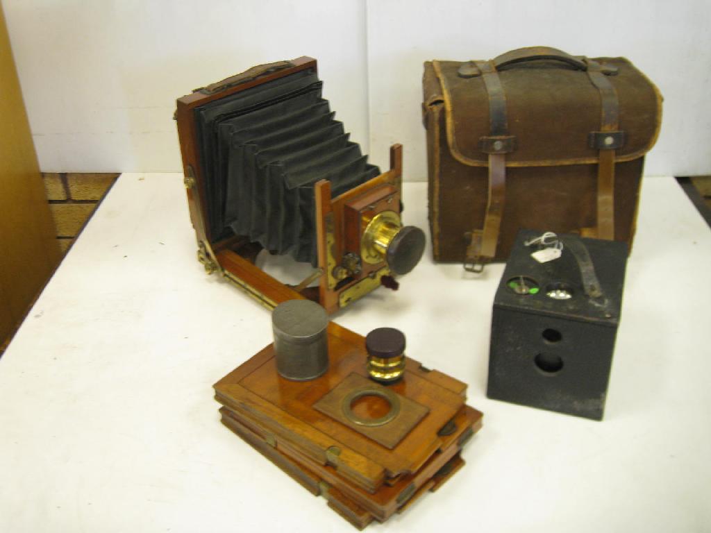 Appraisal: A mahogany plate Field Camera with two Lenses Plate Holders