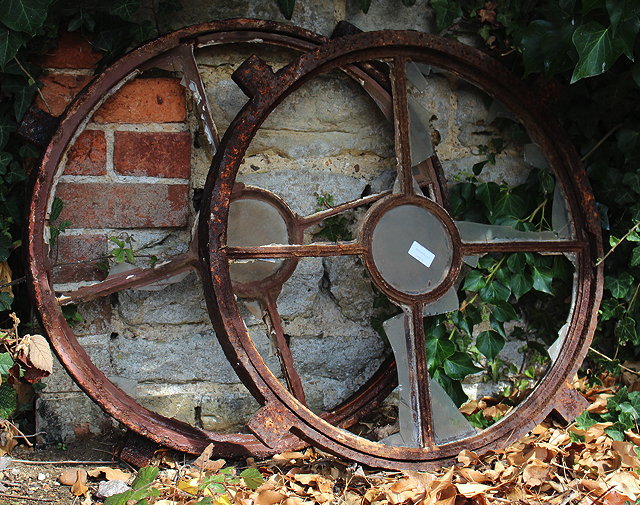 Appraisal: A PAIR OF CIRCULAR CAST IRON WINDOWS each approximately cm