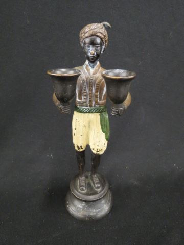 Appraisal: Bronze Figurine of a Blackamoor candle holder cold painted