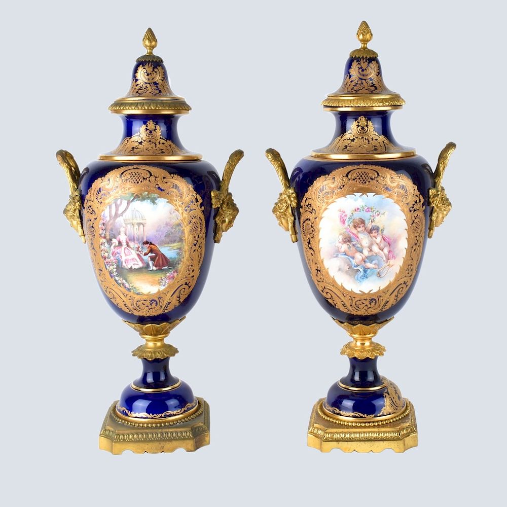 Appraisal: Sevres Urns Pair of Sevres Style Cobalt and Bronze Mounted