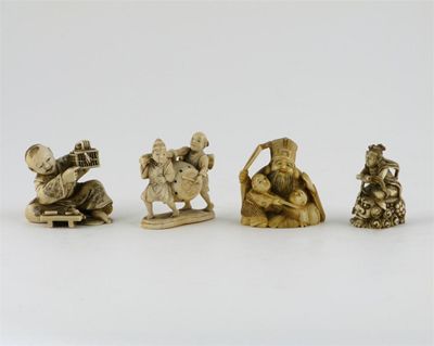 Appraisal: Four small Japanese ivory okimono one of a small boy