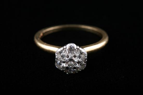 Appraisal: K YELLOW AND WHITE GOLD AND DIAMOND CLUSTER RING Seven