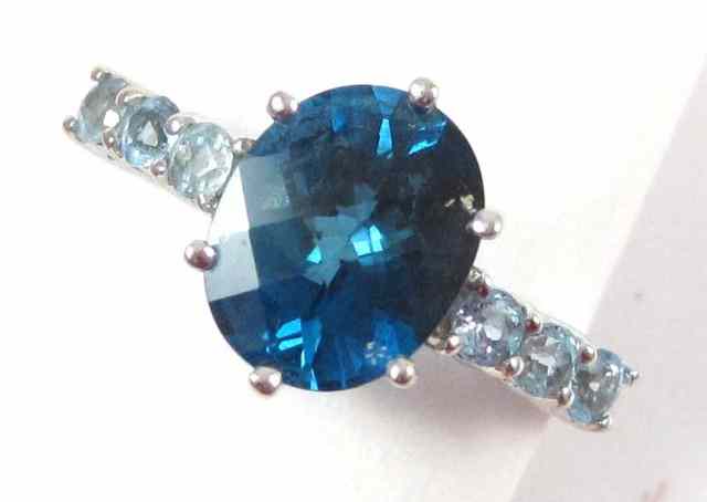 Appraisal: BLUE TOPAZ AND TEN KARAT GOLD RING white gold set