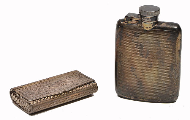 Appraisal: A GEORGE V SILVER HIP FLASK with engine cut decoration