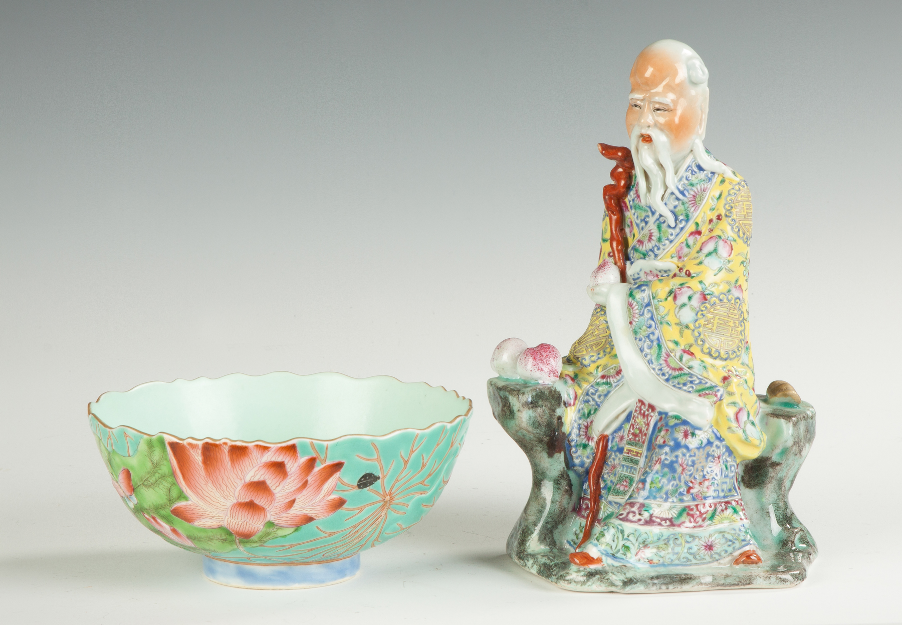 Appraisal: Chinese Porcelain Seated Figure with Peach