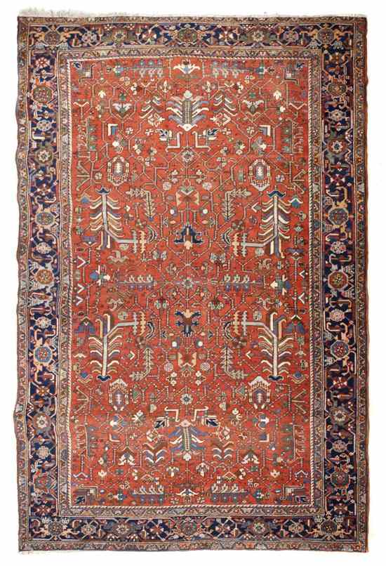 Appraisal: A Heriz Wool Carpet having repeating geometric decoration on a