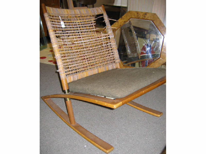 Appraisal: DANISH MODERN SCISSOR-FORM ROCKER with caned back panel torn and