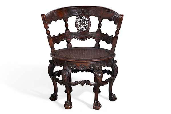 Appraisal: A Dutch Colonial burgomeister s chair A Dutch Colonial carved