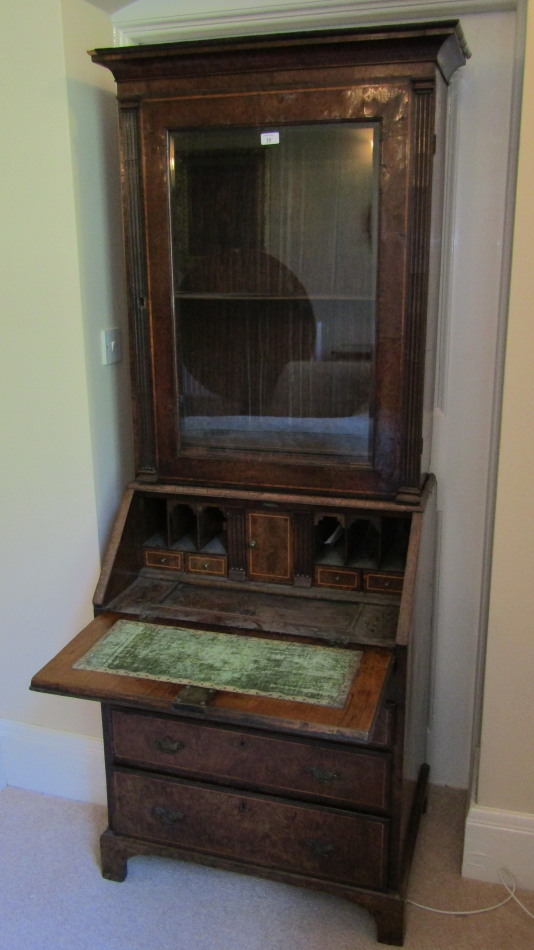 Appraisal: A George I burr walnut and yew cabinet bureau bookcase