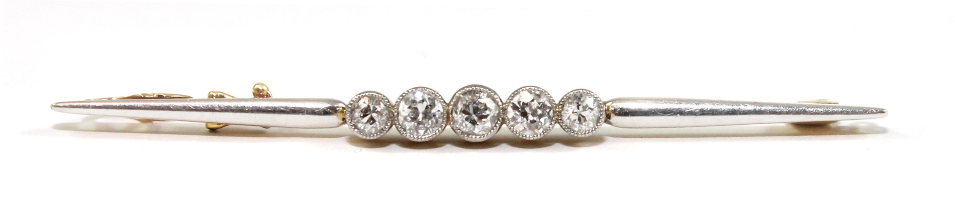 Appraisal: A gold and platinum fronted diamond set five stone bar