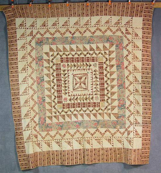 Appraisal: Pieced Chintz Quilt Radiating zigzag pattern in earth tones Some