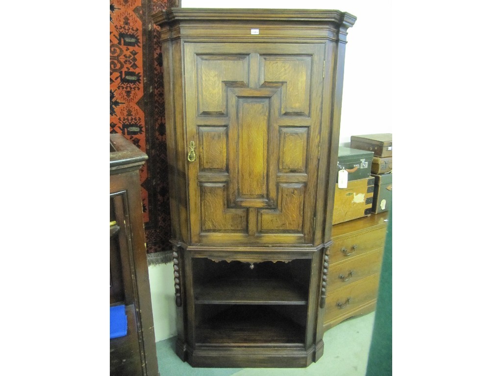 Appraisal: Good reproduction th century style oak corner cupboard on stand