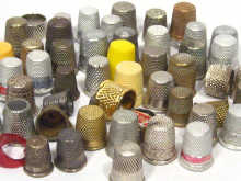 Appraisal: Sewing Interest A collection of approx metal and plastic thimbles