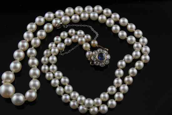 Appraisal: A single strand cultured pearl necklace with sapphire and diamond