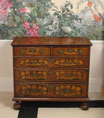 Appraisal: A walnut and marquetry chest the banded top with a