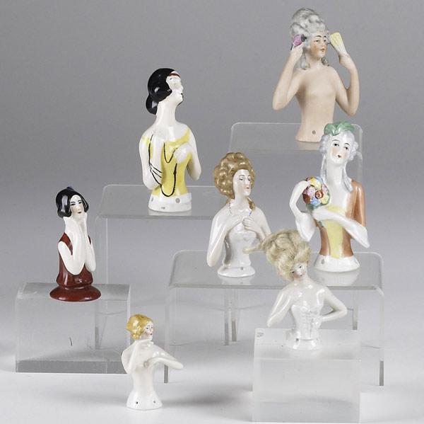 Appraisal: PINCUSHION FIGURES Seven pieces include nudes colonial and art deco