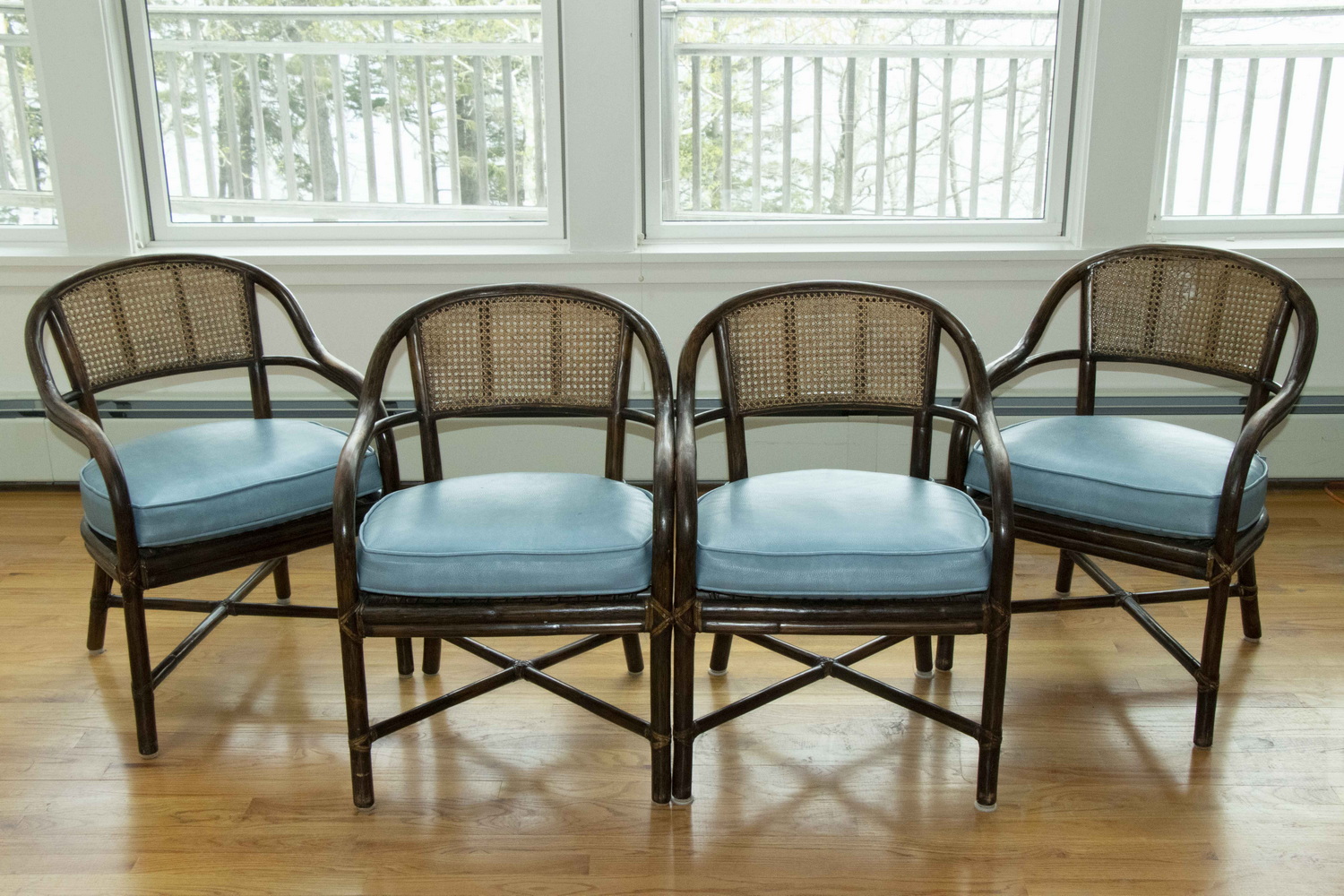 Appraisal: SET OF FOUR RATTAN CHAIRS Set of dark stained rattan