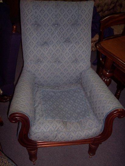 Appraisal: A Victorian mahogany framed armchair with square buttoned back and