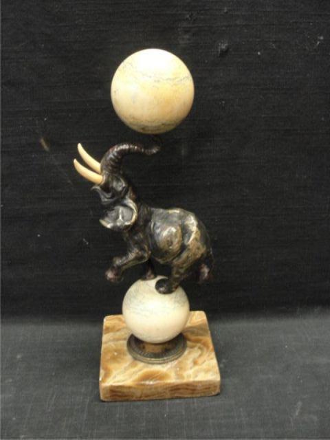 Appraisal: Ivory Elephant on Ivory Ball Balancing Ivory Ball Old repair