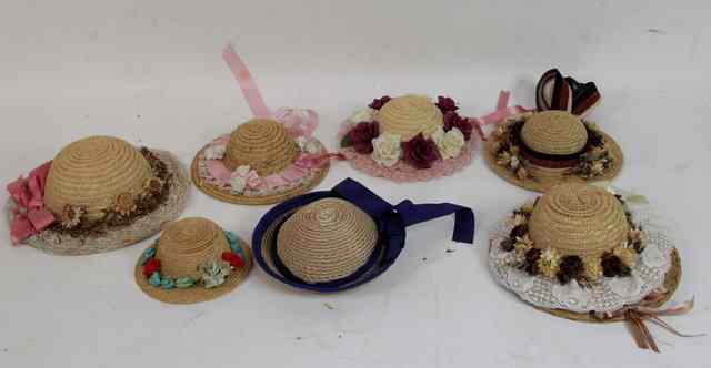 Appraisal: A collection of eight dolls straw hats