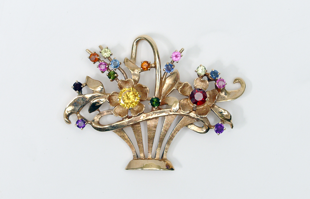 Appraisal: GOLD JEWELED BASKET BROOCH K yellow gold pin in the