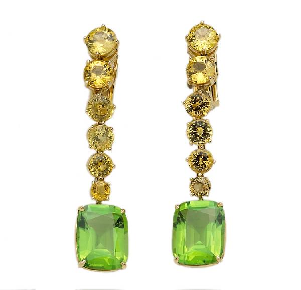 Appraisal: A pair of peridot and yellow sapphire day-night clip-earrings estimated