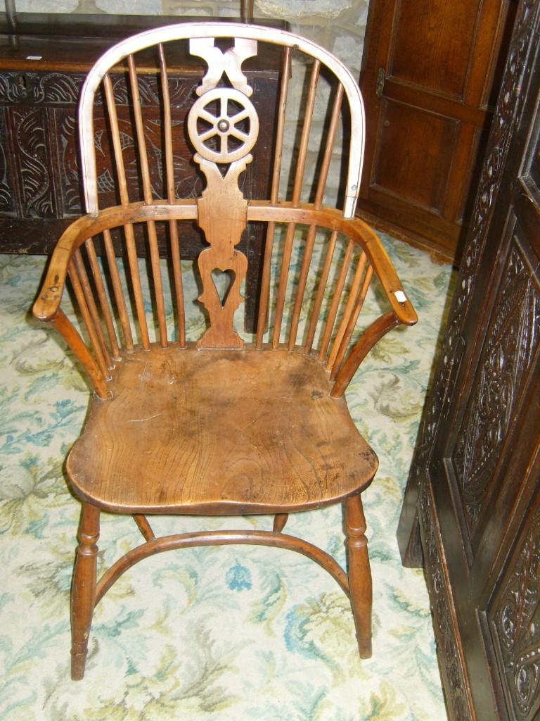 Appraisal: A Windsor elbow chair in elm and yew wood with