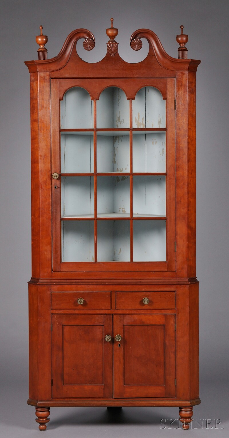 Appraisal: Red-stained and Carved Glazed Cherry Two-part Corner Cupboard possibly Connecticut