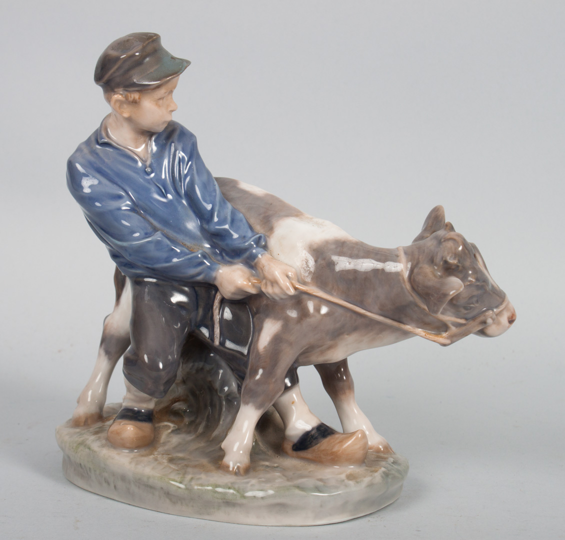 Appraisal: Royal Copenhagen boy and calf porcelain group by Christian Thomsen